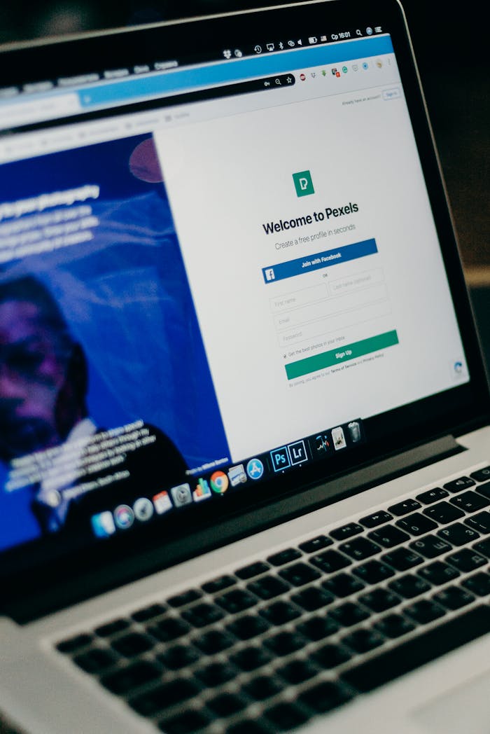 get-in-touch Close-up view of a laptop displaying a sign-up page for an online platform.