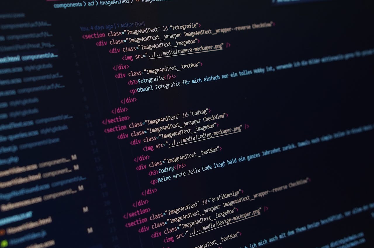 home-hero Close-up view of HTML code displayed on a dark screen, showcasing coding concepts.